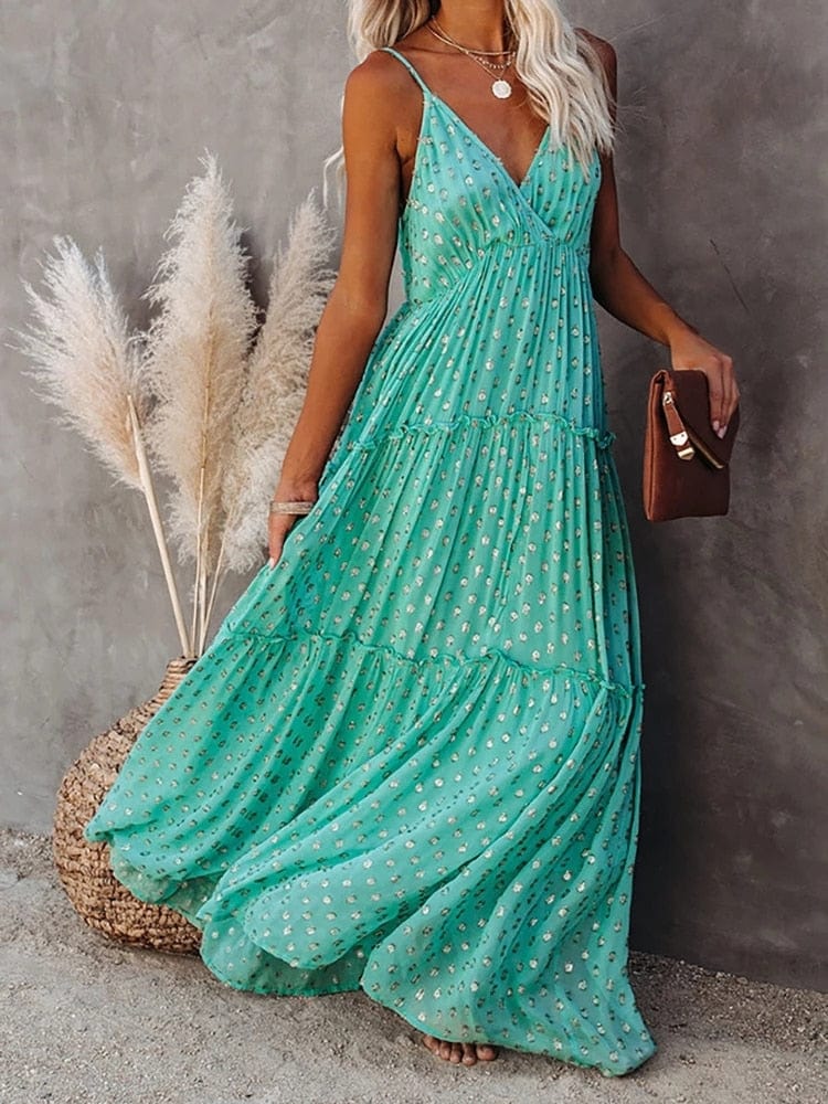 https://cdn.shopify.com/s/files/1/0880/2333/5247/files/groene-maxi-jurk-met-v-hals-en-zomers-ibiza-printje-50781512073542.jpg?v=1735256179